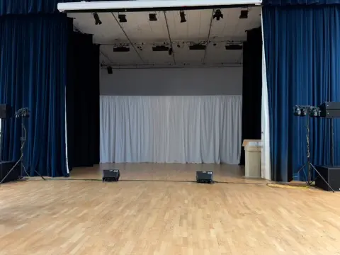 8 meter by 3 meter white backdrop from truss frame eight led pars in Sheffield, South Yorkshire.